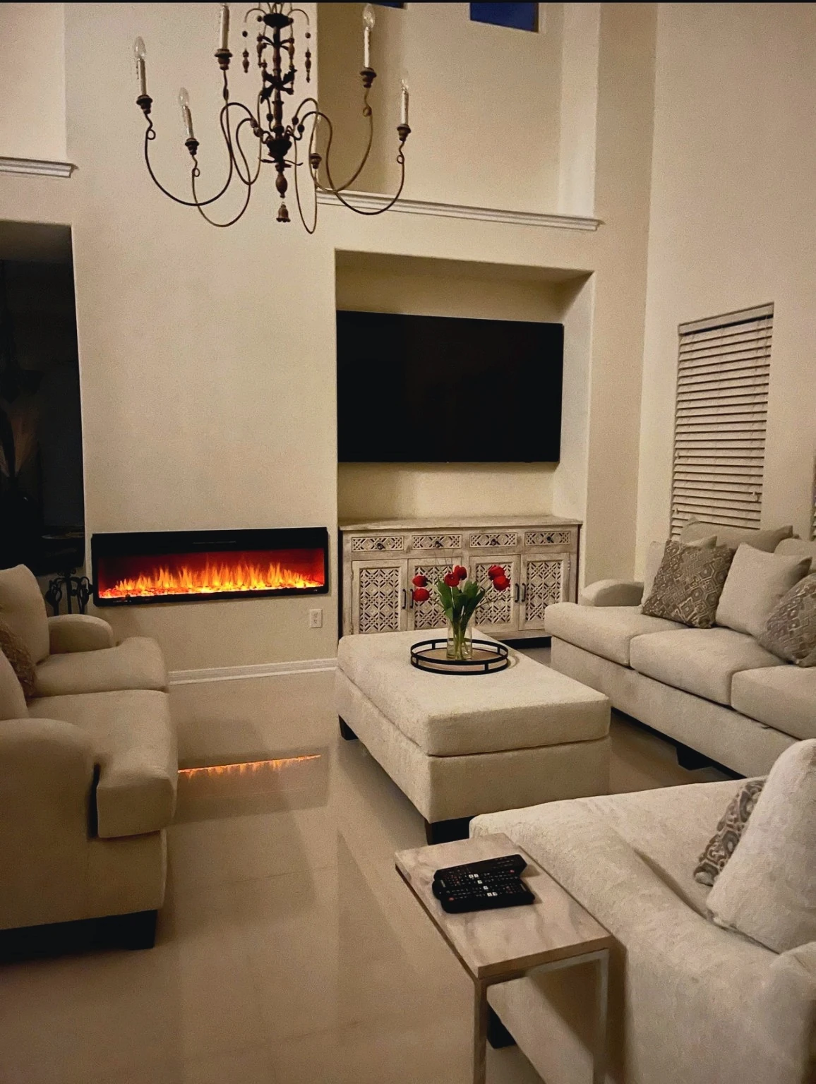 Living room with linear fireplace in evening lighting