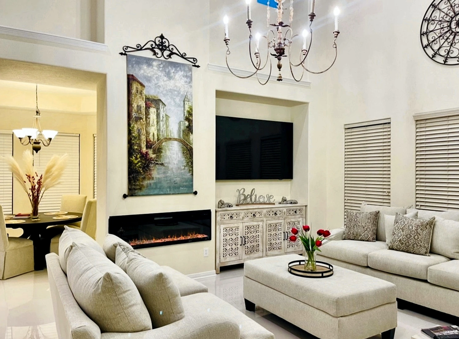 Bright completed living room with linear fireplace and television
